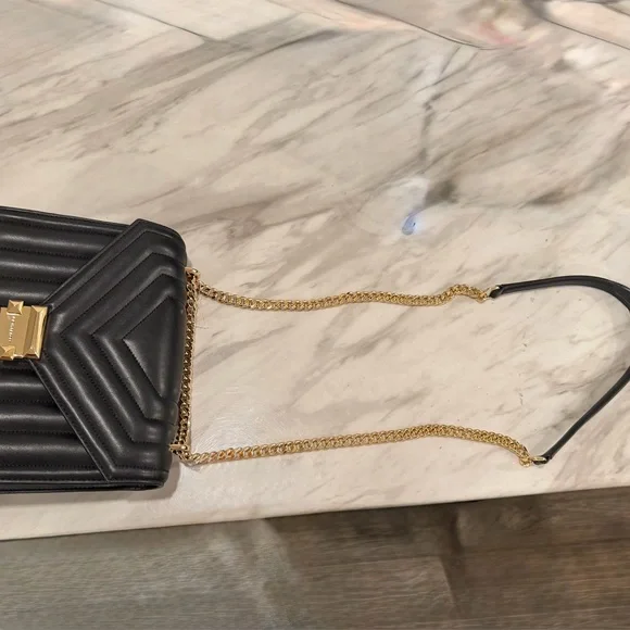 Michael Kors Black Quilted Crossbody Bag with Gold Accents
New with Tags - Picture 4 of 4